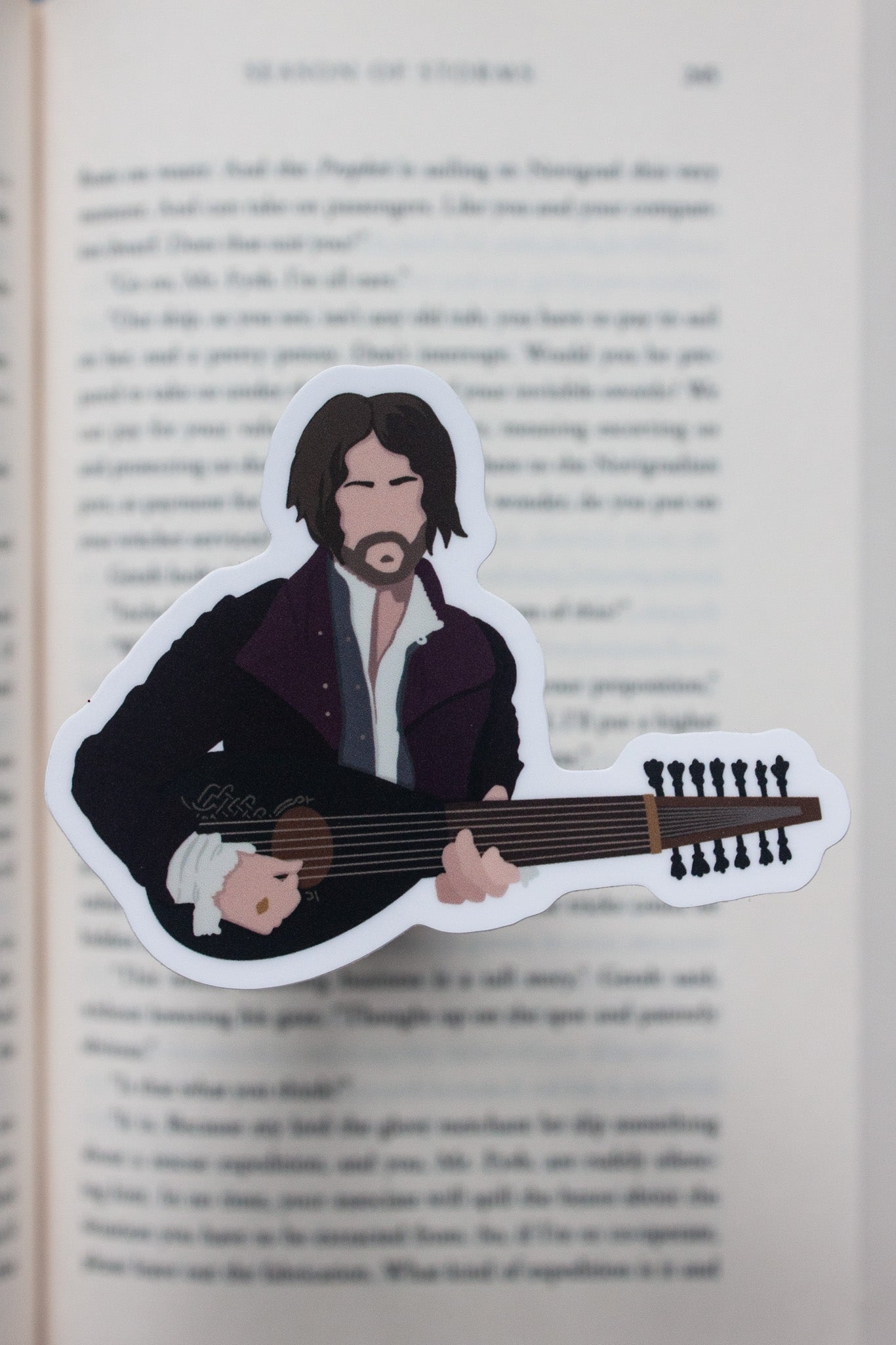 Dandelion the bard Witcher sticker, depicting the charming musician with his lute and signature flamboyant clothing. A great gift for fans of The Witcher’s witty character.